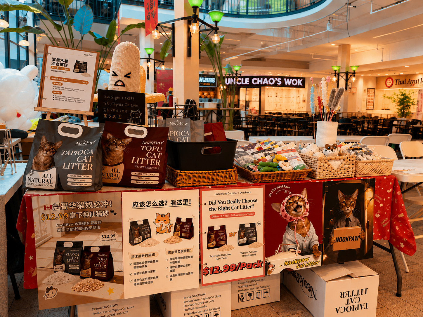 NookPaw community event display with tofu and tapioca cat litter, educational materials, and pet essentials
