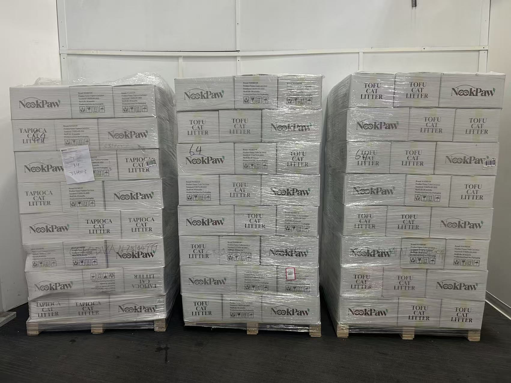 Pallets of NookPaw cartons wrapped and staged in the Cattus warehouse